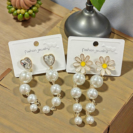 12 Aretes Perlas Colgantes con Pedreria $13.7 c/u