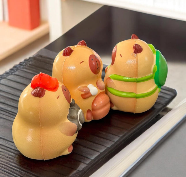 12 Squishies capibaras G $13.5 c/u