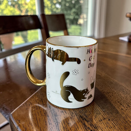 3 Taza "Happy Cat Day" Dorada $32 c/u