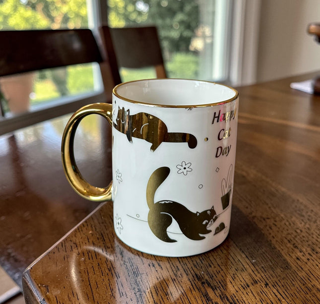 3 Taza "Happy Cat Day" Dorada $32 c/u