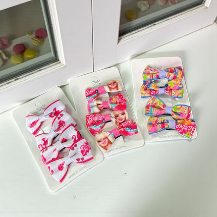 12 Sets de 4 moños barbie $8.84 c/u