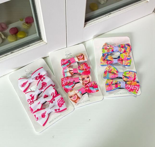 12 Sets de 4 moños barbie $8.84 c/u