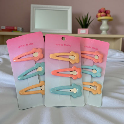 12 Sets de Cucas Flor Colores $8.9 c/u