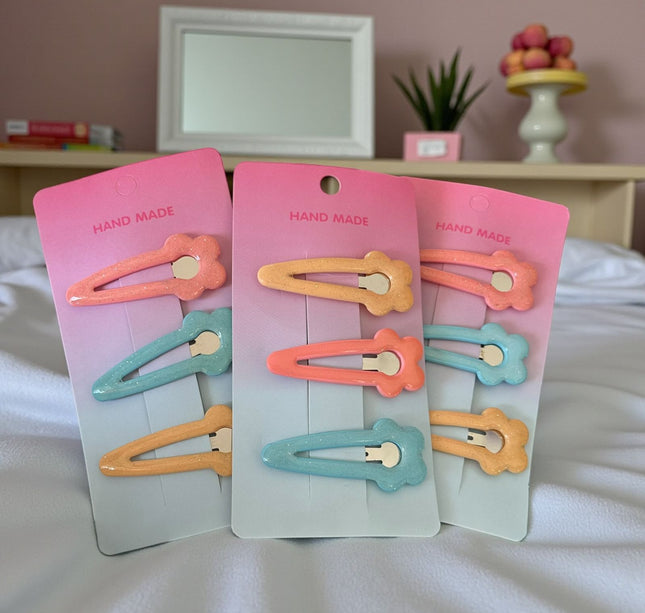 12 Sets de Cucas Flor Colores $8.9 c/u