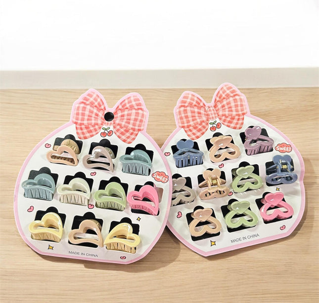 12 Sets de 10 pincitas para Cabello Figuras $12.5 c/u