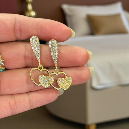 12 Aretes Dorados Pedreria Zirconia Corazon $17.7 c/u