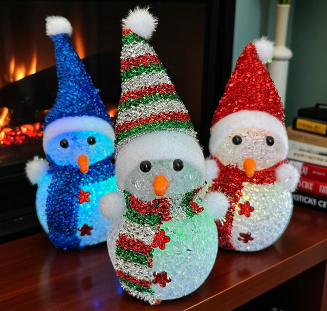 6 Muñeco de Nieve Navideño con luces y Gorro  $25 c/u