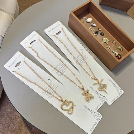 12 Collar Acero Inoxidable Figuras con Pedreria Dorado/Plateado $10 c/u