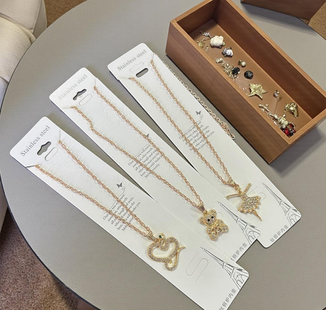 12 Collar Acero Inoxidable Figuras con Pedreria Dorado/Plateado $10 c/u