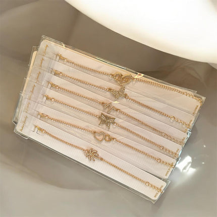 12 Pulseras Doradas con Dije $5.6 c/u