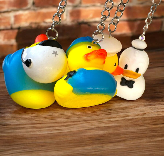 12 Llaveros patito figuras $6.9 c/u