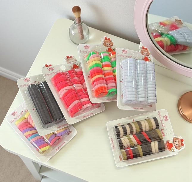 12 Estcuches de Donitas para Cabello Colores $8.3 c/u