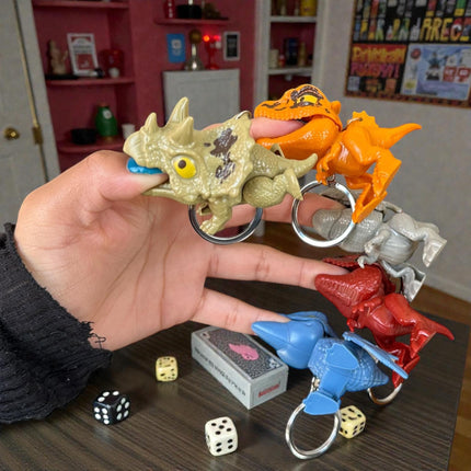 12 Llaveros Dinosaurios Mordelones $10.2 c/u