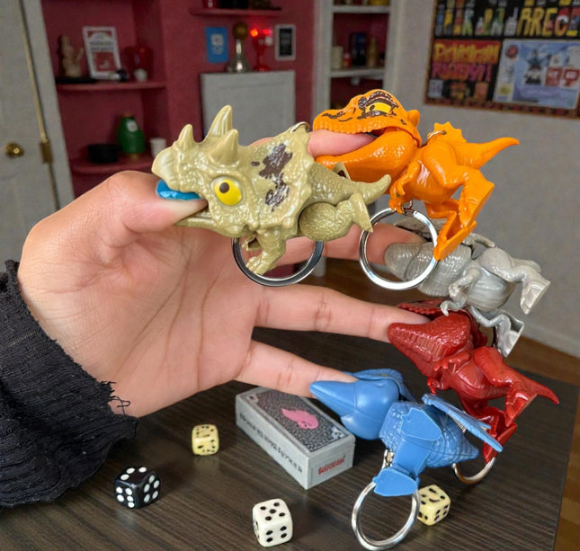 12 Llaveros Dinosaurios Mordelones $10.2 c/u