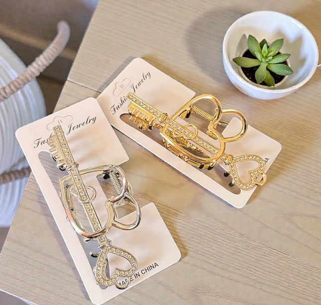 12 Pinzas para Cabello Doradas/Plateadas Corazón con Pedreria  $26 c/u