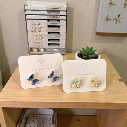 12 Aretes Mariposa Linda Tornasol Colores $12.92 c/u