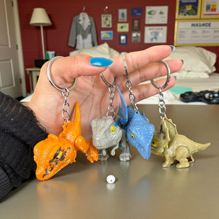 12 Llaveros Dinosaurios Mordelones $10.2 c/u