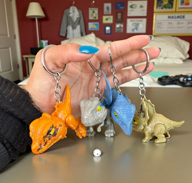 12 Llaveros Dinosaurios Mordelones $10.2 c/u