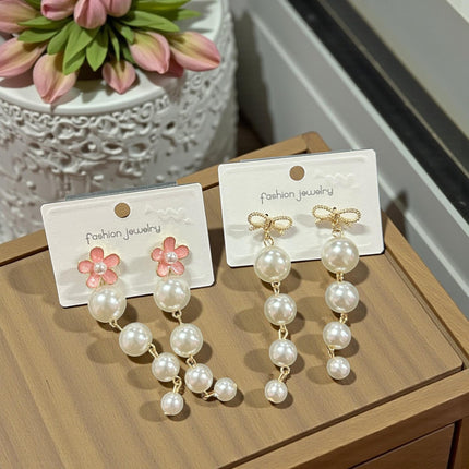 12 Aretes Perlas Colgantes con Pedreria $13.7 c/u