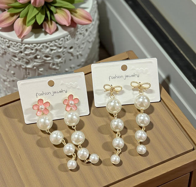 12 Aretes Perlas Colgantes con Pedreria $13.7 c/u