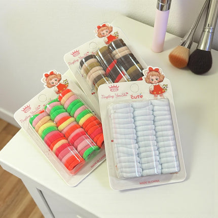 12 Estcuches de Donitas para Cabello Colores $8.3 c/u