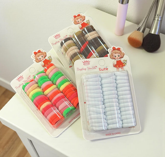 12 Estcuches de Donitas para Cabello Colores $8.3 c/u