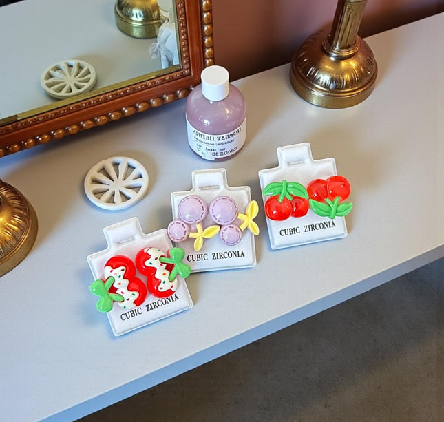 36 Aretes Cereza/Fresa Zirconia $3.58 c/u