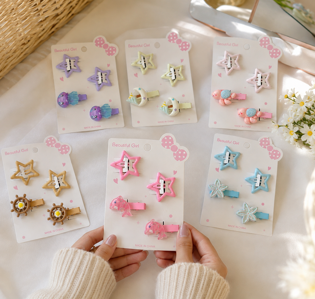 12 Sets de Cucas Estrella y Pasadores "Mar"  $7.5 c/u