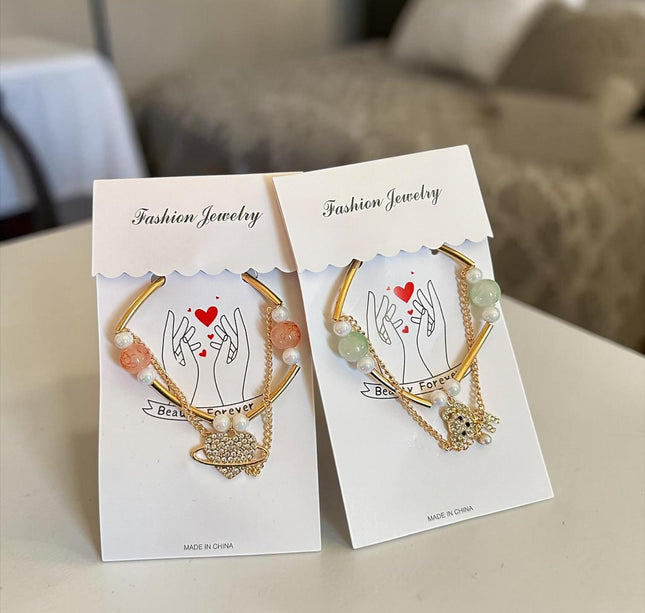 12 Pulseras Dobles  Doradas Dije con Perlas $6.8 c/u