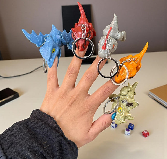 12 Llaveros Dinosaurios Mordelones $10.2 c/u