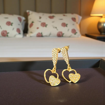 12 Aretes Dorados Pedreria Zirconia Corazon $17.7 c/u