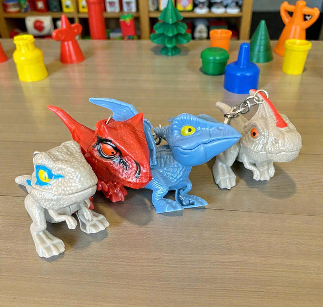 12 Llaveros Dinosaurios Mordelones $10.2 c/u