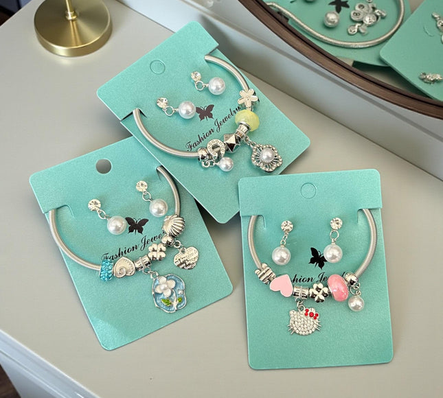 12 Sets Aretes y Pulseras Tipo Pandora con Charms de Figuras  Pedreria $13 c/u