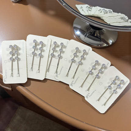 12 Pares de Pasadores Plateados con Pedrería $8.25 c/u