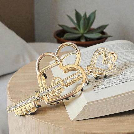 12 Pinzas para Cabello Doradas/Plateadas Corazón con Pedreria  $26 c/u