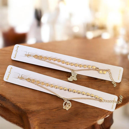 12 Pulseras Doradas con Dije $5.6 c/u