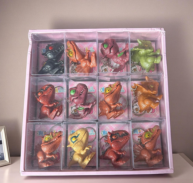 24 Llaveros Dinosauiros Mordelones en Cajita $19 c/u