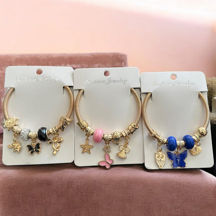 12 Pulseras tipo Pandora con Dijes de figuras $11.58 c/u