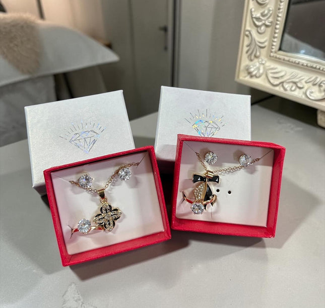 12 Sets Joyeria Collar,Anillo y Aretes con Pedreria y Caja de Regalo Dorada $22.5 c/u