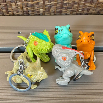 12 Llaveros Dinosaurios Mordelones $10.2 c/u