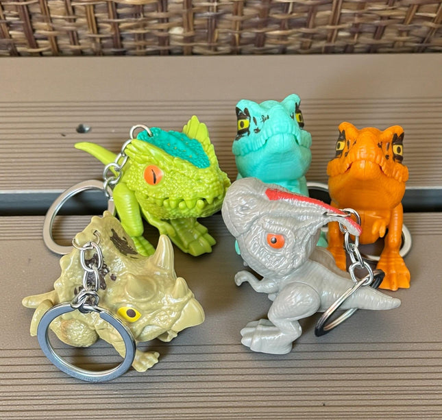 12 Llaveros Dinosaurios Mordelones $10.2 c/u