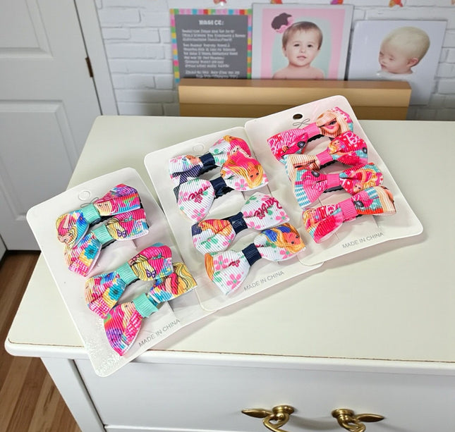 12 Sets de 4 moños barbie $8.84 c/u